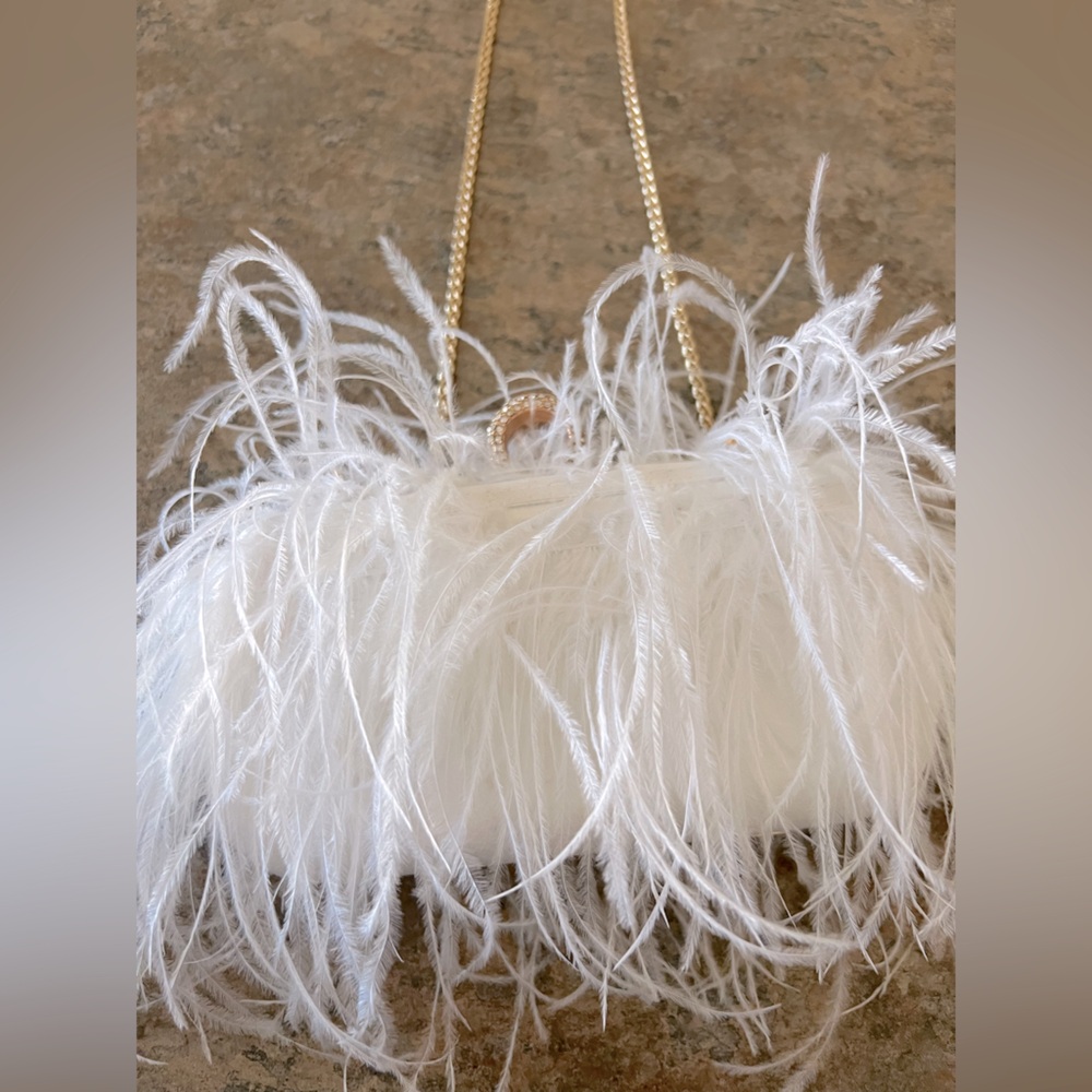 Francesca’s white feather purse